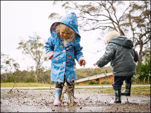 Children’s Backs and Back Packs 5 Jumping in the rain